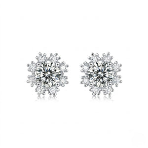 Sterling silver moissanite stud earrings featuring a brilliant round cut snowflake design