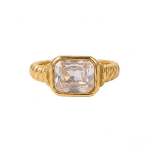 Gold premier bezel ring with a square-cut clear gemstone in a ribbed band design.
