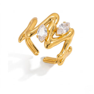 Gold marquise vine ring with two marquise-cut crystals in an abstract design on white background