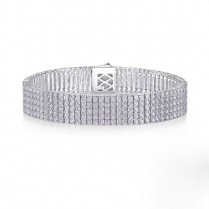 Wide multi-row sterling silver tennis bracelet fully set with round cubic Moissanite crystals featuring a secure box clasp shown on a plain white background by J.Collins