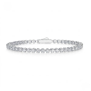 Classic single-row sterling silver tennis bracelet set with round cubic Moissanite crystals and a secure clasp shown on a plain white background by J.Collins