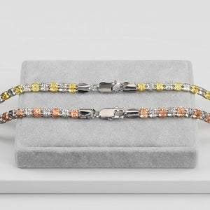 Italian two-tone bead necklaces with silver, gold, and rose gold accents on a gray display stand.