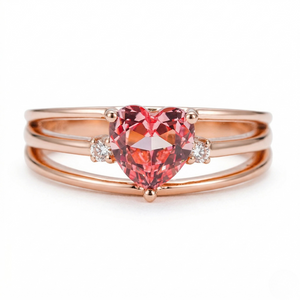 18K rose gold ring with heart-shaped pink gemstone and two small diamonds on a triple band design