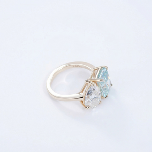 14K yellow gold moissanite ring with dual pear-shaped stones, elegant and modern design