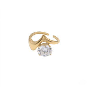 Unique gold ring featuring a large round-cut sparkling gemstone isolated on a white background | J.Collins Jewelry