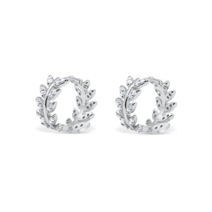 Pair of silver hoop earrings with leaf design on a white background-Imperial-leaf-hoops-JCollins