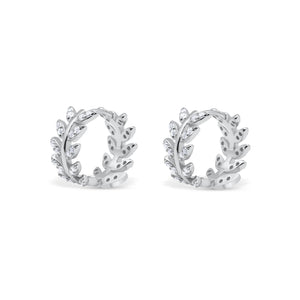 Pair of silver hoop earrings with leaf design on a white background-Imperial-leaf-hoops-JCollins