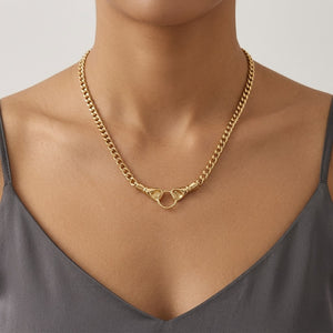 Model wearing a statement gold chain necklace featuring a vintage-inspired hand-clasped ring design | J.Collins Jewelry