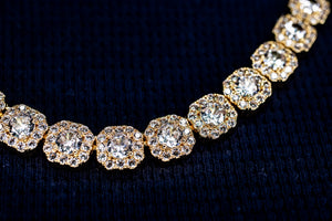 Gold necklace with diamond-like stones on a dark background-10mm-Tennis-Chain-JCollins-Jewelry