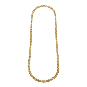 Gold mesh rope necklace on white background