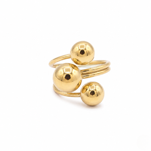 Modern multi-layer gold bypass ring featuring three polished spheres of varying sizes isolated on a white background | J.Collins Jewelry