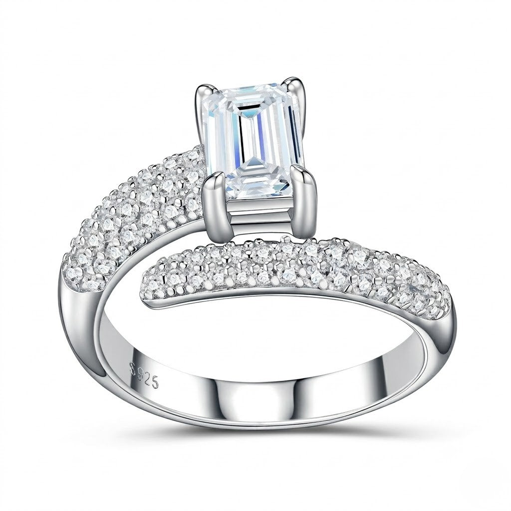White-gold ring with a large central gemstone and smaller stones on a white background - J.Collins Jewelry