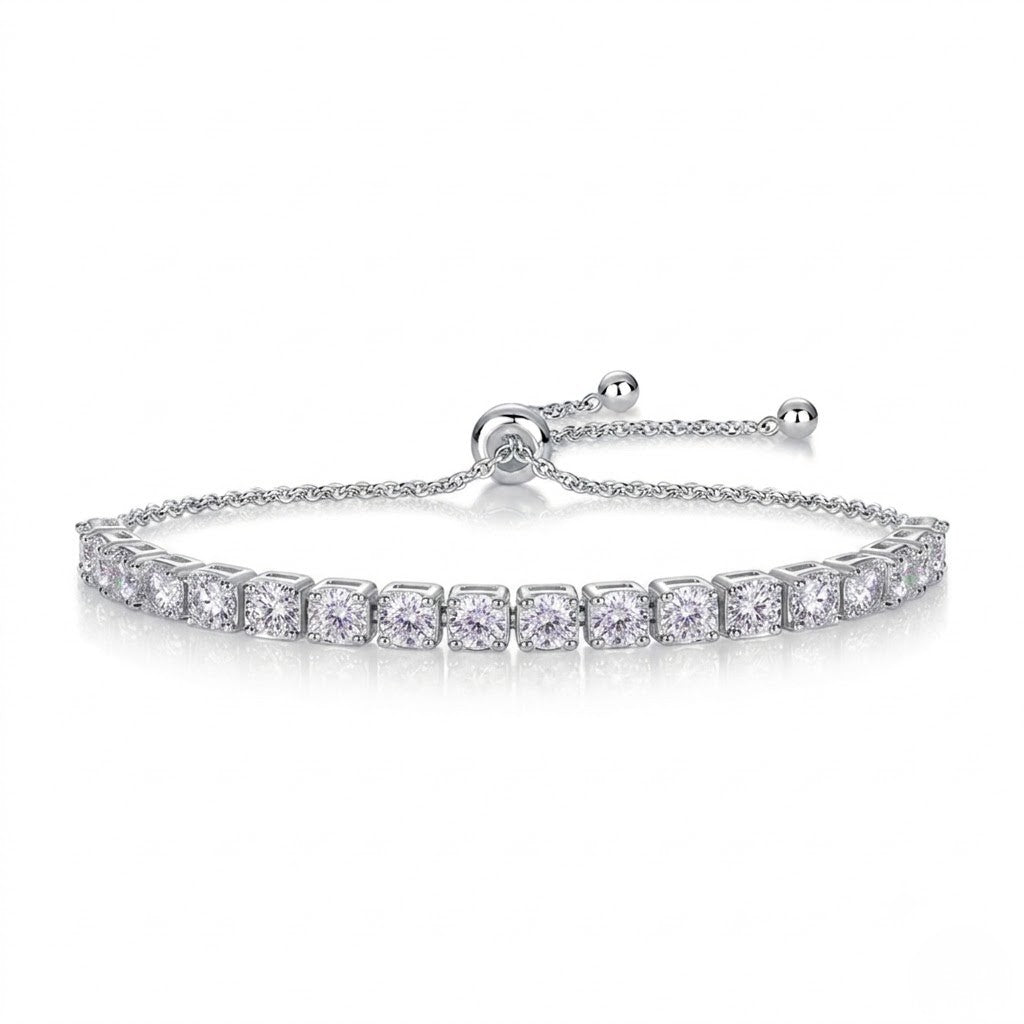 A tennis bracelet with a row of clear square-cut stones, featuring an adjustable sliding clasp with ball ends on a white background.