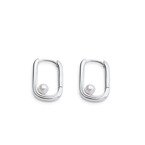 Pair of silver hoop earrings with pearls on a white background - Selene Pearl Hoops - JCollins Jewelry