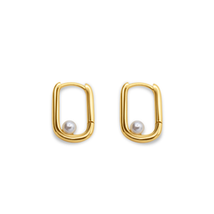 Gold hoop earrings with pearl centers on a white background-Selene-Pearl-Hoops-J.Collins Jewelry