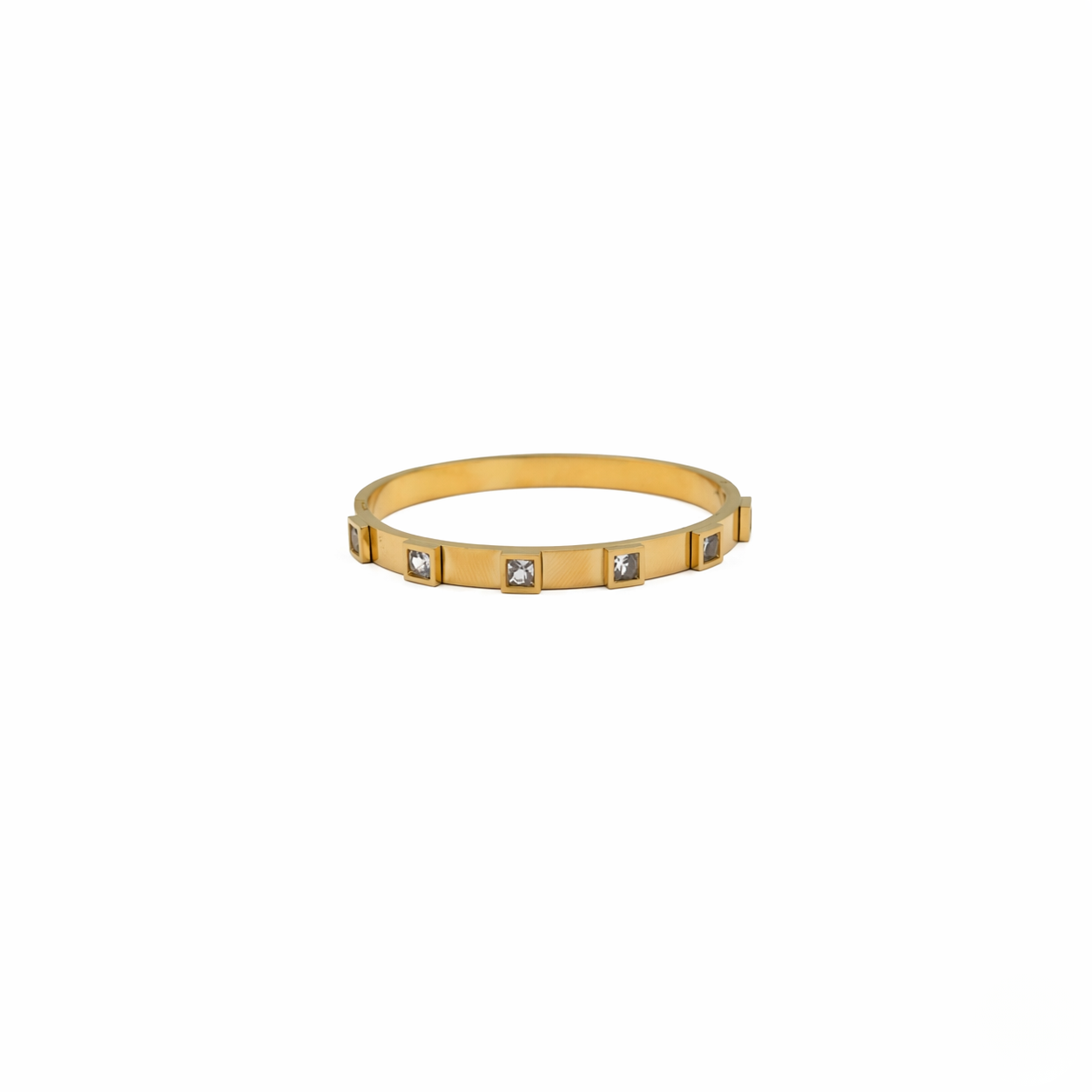 Gold bracelet with embedded stones on a white background-J.Collins Jewelry