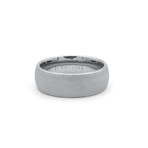 The Titan (8mm) ring with 'J. Collins' engraving on a white background