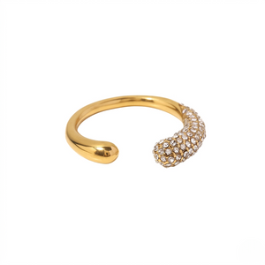 Gold curved pavé ring with sparkling stones on one end