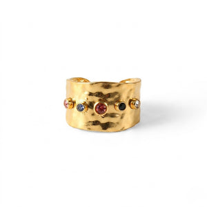 Gold hammered band with colorful gemstones inlaid, featuring a wide, textured design.