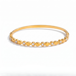 Steel Modern Link Bangle in gold with linked design and embedded gemstones on a white background