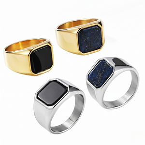 Onyx and blue stone signet rings in gold and silver tones, showcasing bold, sleek styles.