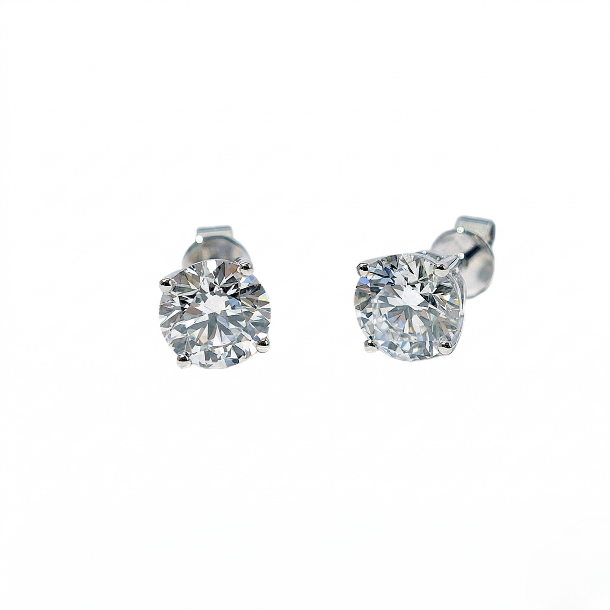 Pair of diamond stud earrings on a white background - White Gold Diamond Earring 1.1ct - J. Collins 