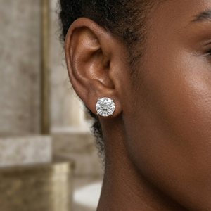 Close up picture of diamond studded earrings worn by a model - 10K White Gold Diamond Earrings 1.1ct - J. Collins Jewelry 