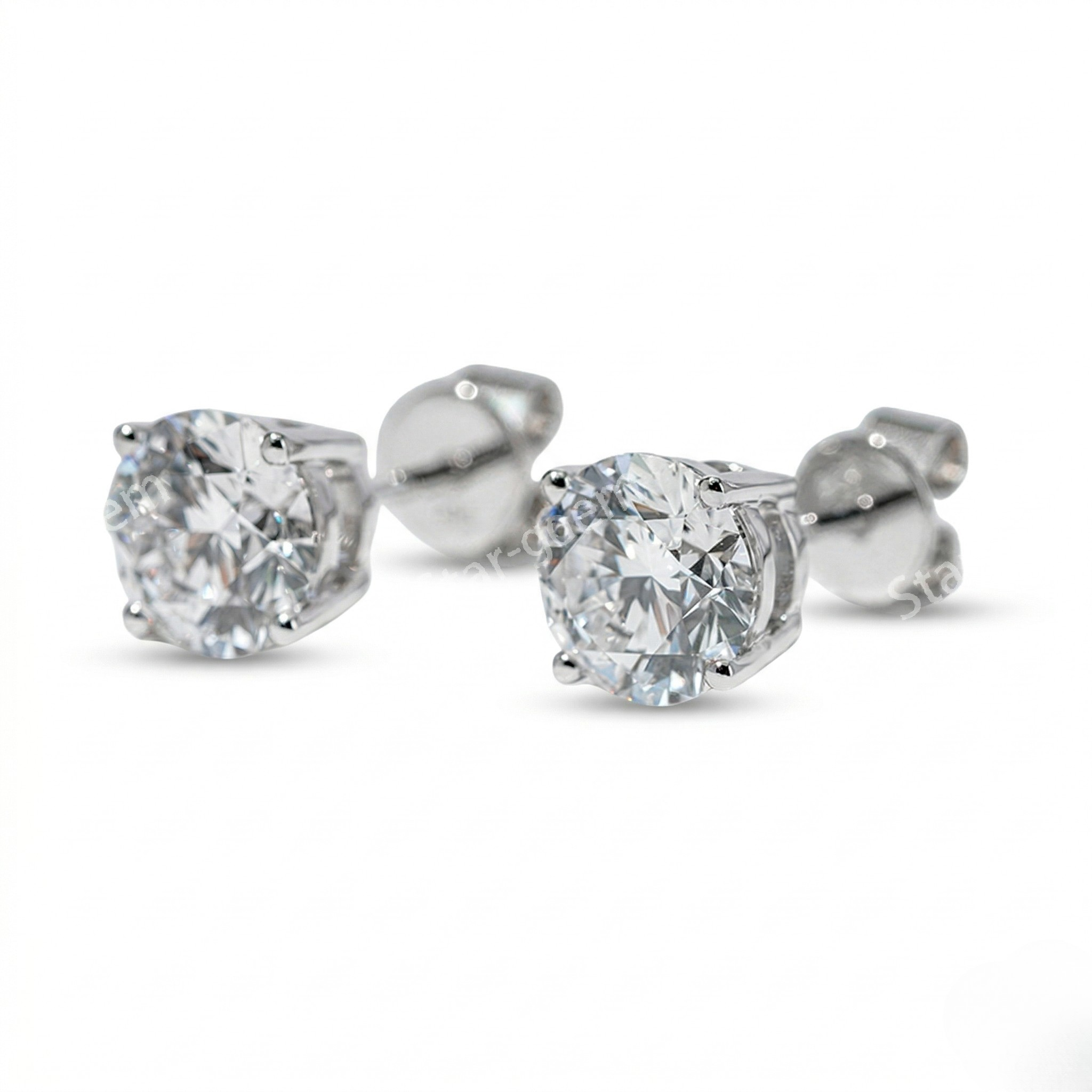 Pair of diamond stud earrings on a white background. - 10K White Gold Diamond Earrings 1.1ct - J. Collins Jewelry 