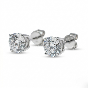 Pair of diamond stud earrings on a white background. - 10K White Gold Diamond Earrings 1.1ct - J. Collins Jewelry 