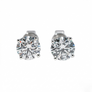 Pair of silver stud earrings with clear gemstones on a white background - 10K White Gold Diamond Earrings - J. Collins Jewelry 