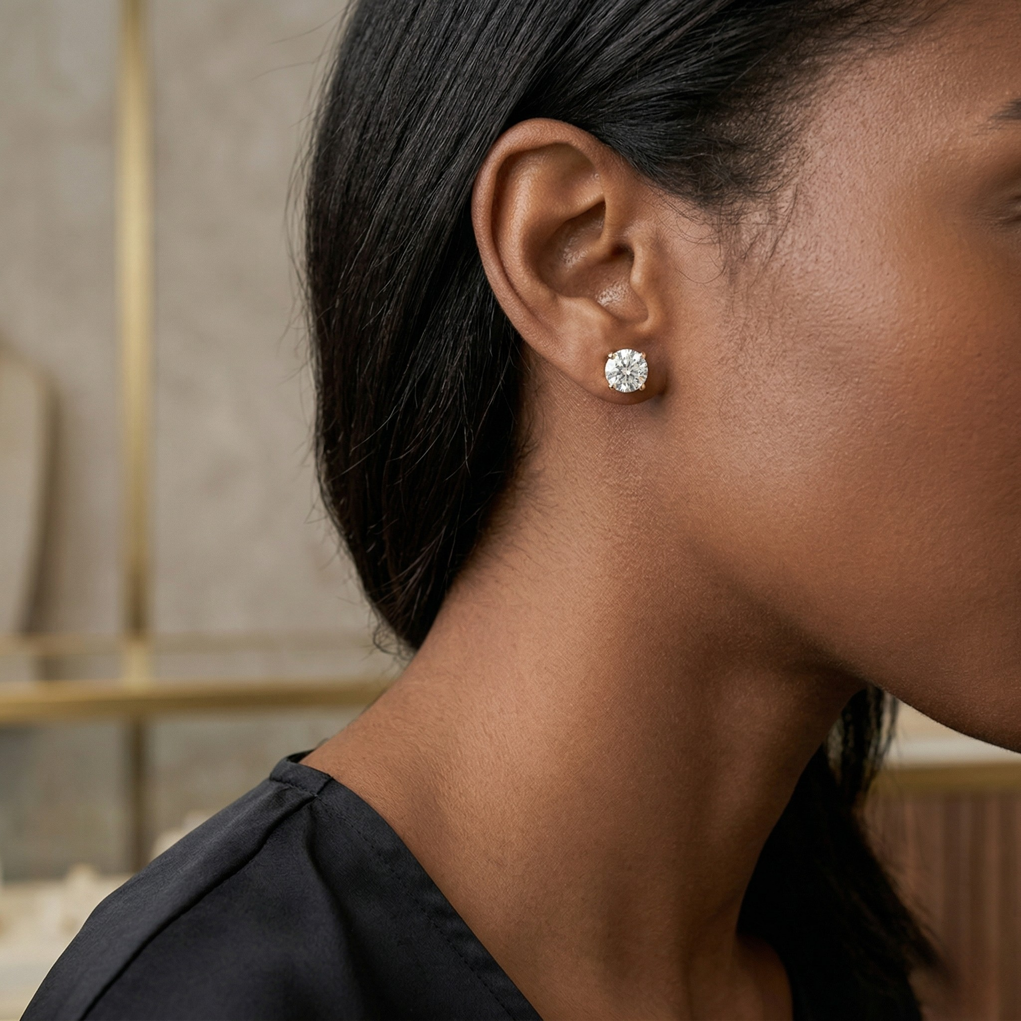 Close-up of a woman wearing a diamond earring - 10K Yellow Gold Lab Diamond Earrings 0.531ct by J.Collins Jewelry 
