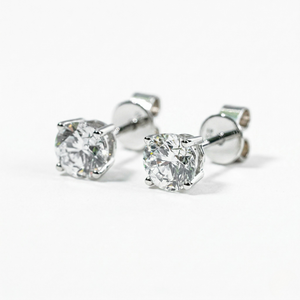 Pair of silver stud earrings with clear gemstones on a white background - White Gold Diamond Earrings - J. Collins Jewelry 