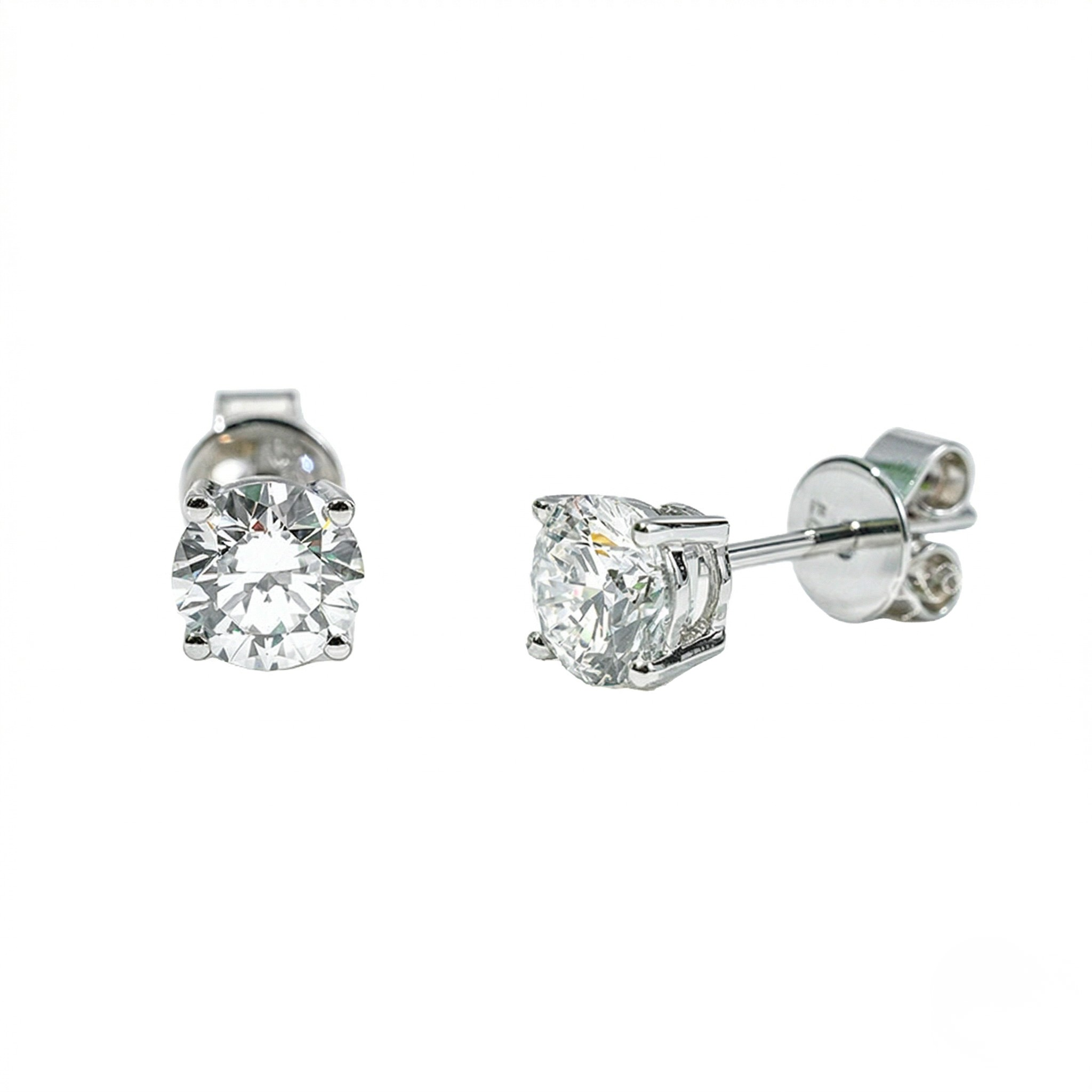 Pair of silver stud earrings with clear gemstones on a white background - 10K White Gold Diamond Earrings - J. Collins Jewelry 