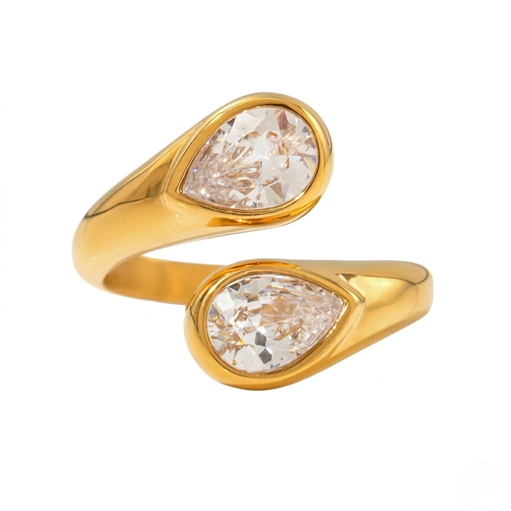 Gold modern teardrop ring with two pear-cut diamonds on an open band design