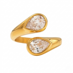Gold modern teardrop ring with two pear-cut diamonds on an open band design
