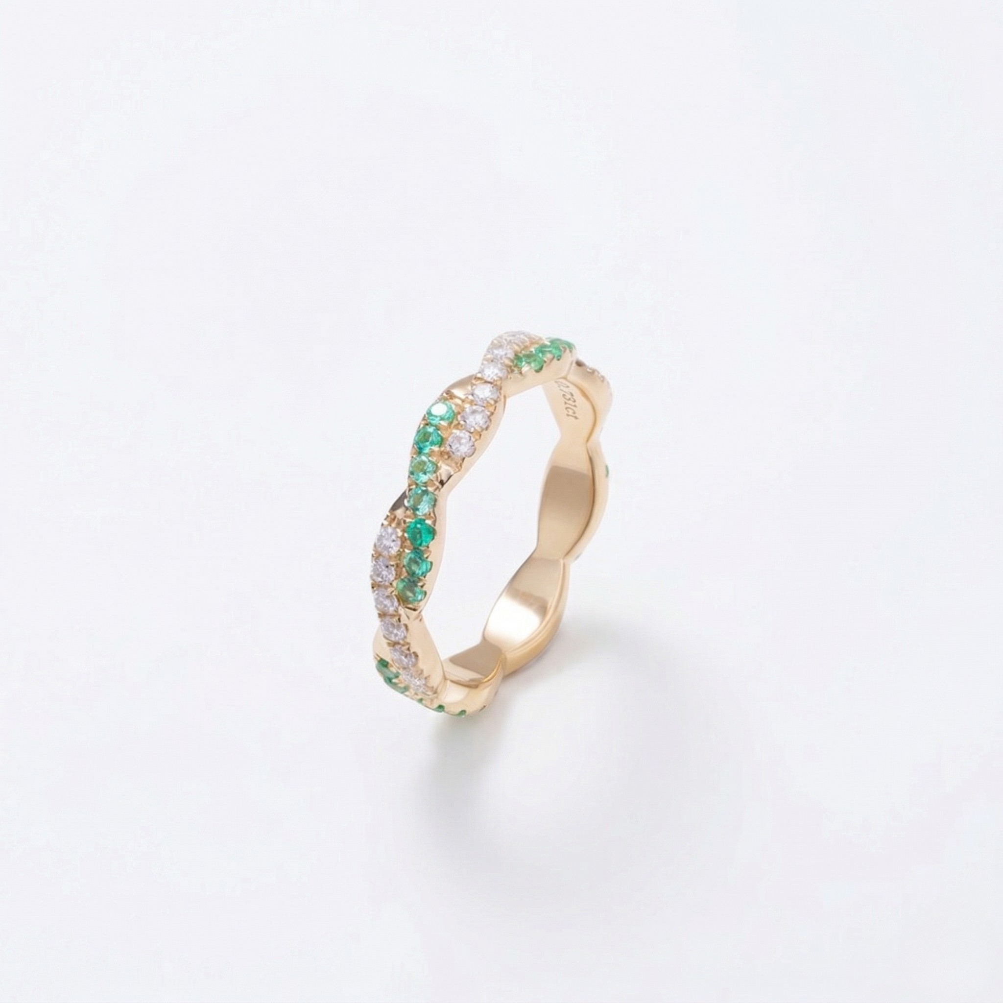 14K yellow gold ring with lab-created emeralds and diamonds in a twisting band style