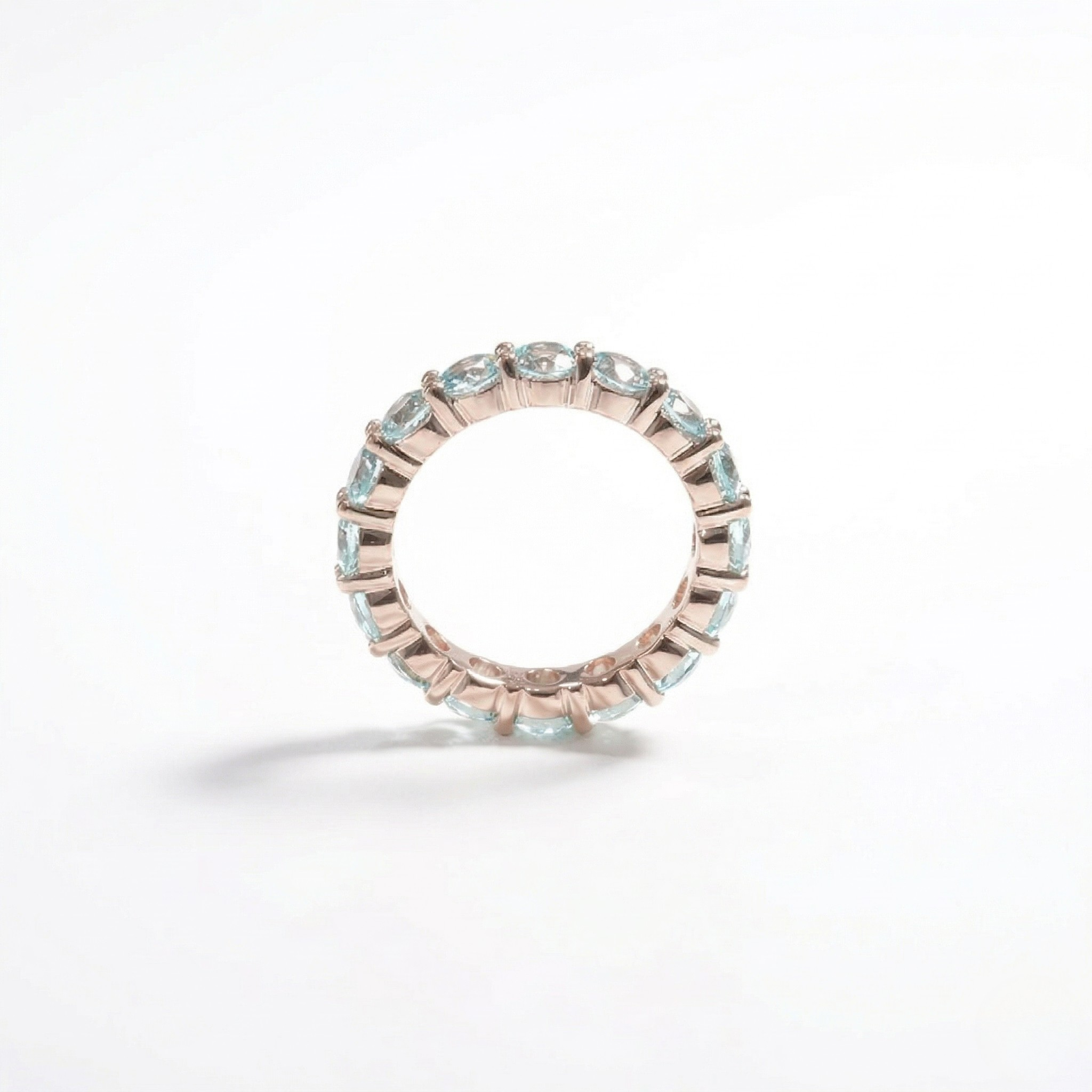 14K rose gold ring with lab-created color gemstones in a continuous band design