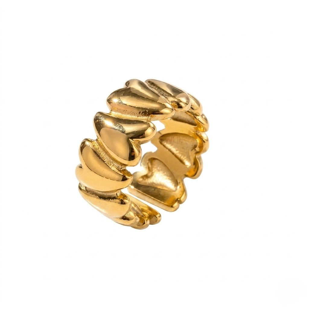 Gold velvet heart ring with a series of linked, polished heart shapes in a band style