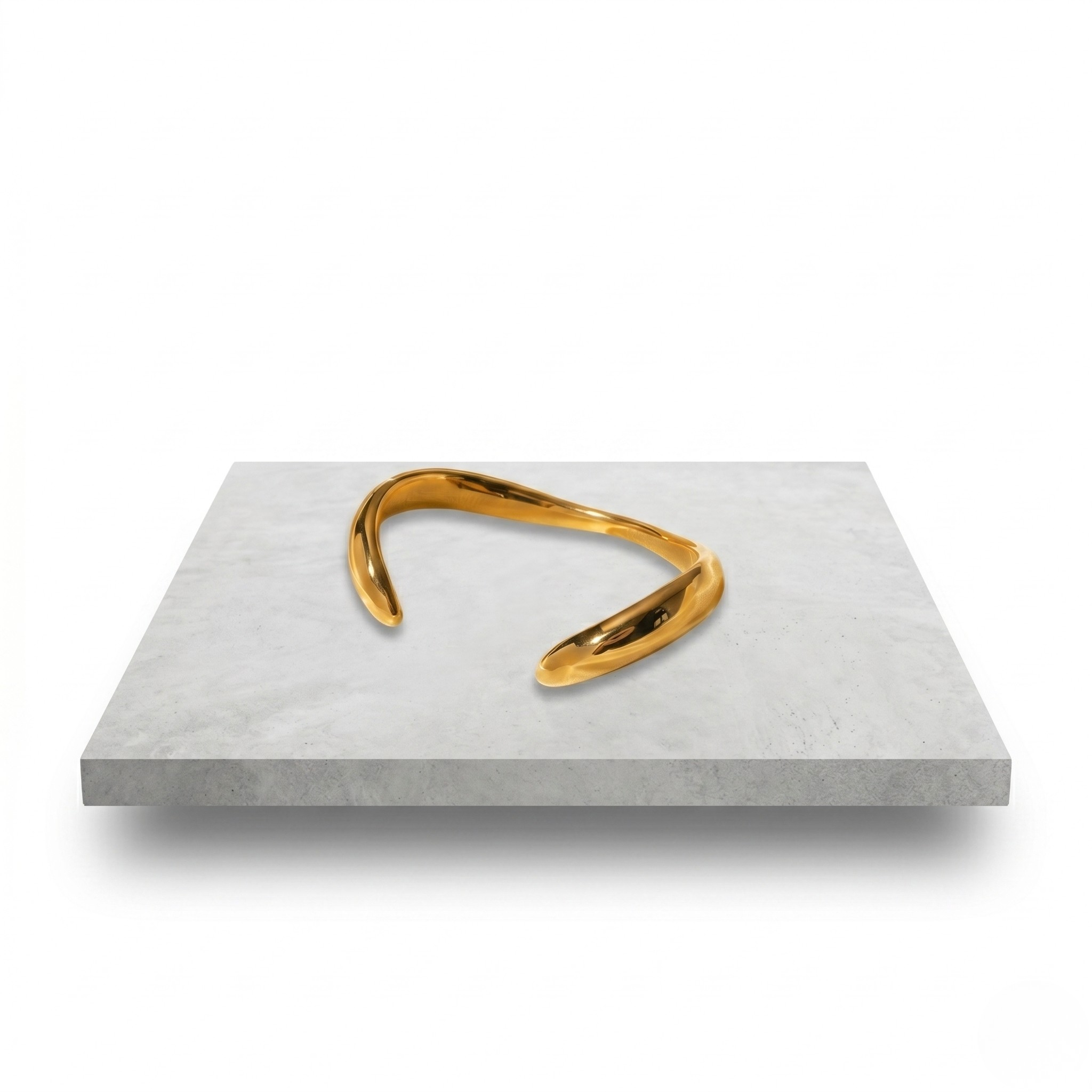 Gold luxury plated cuff bracelet on a white surface, sleek curved design