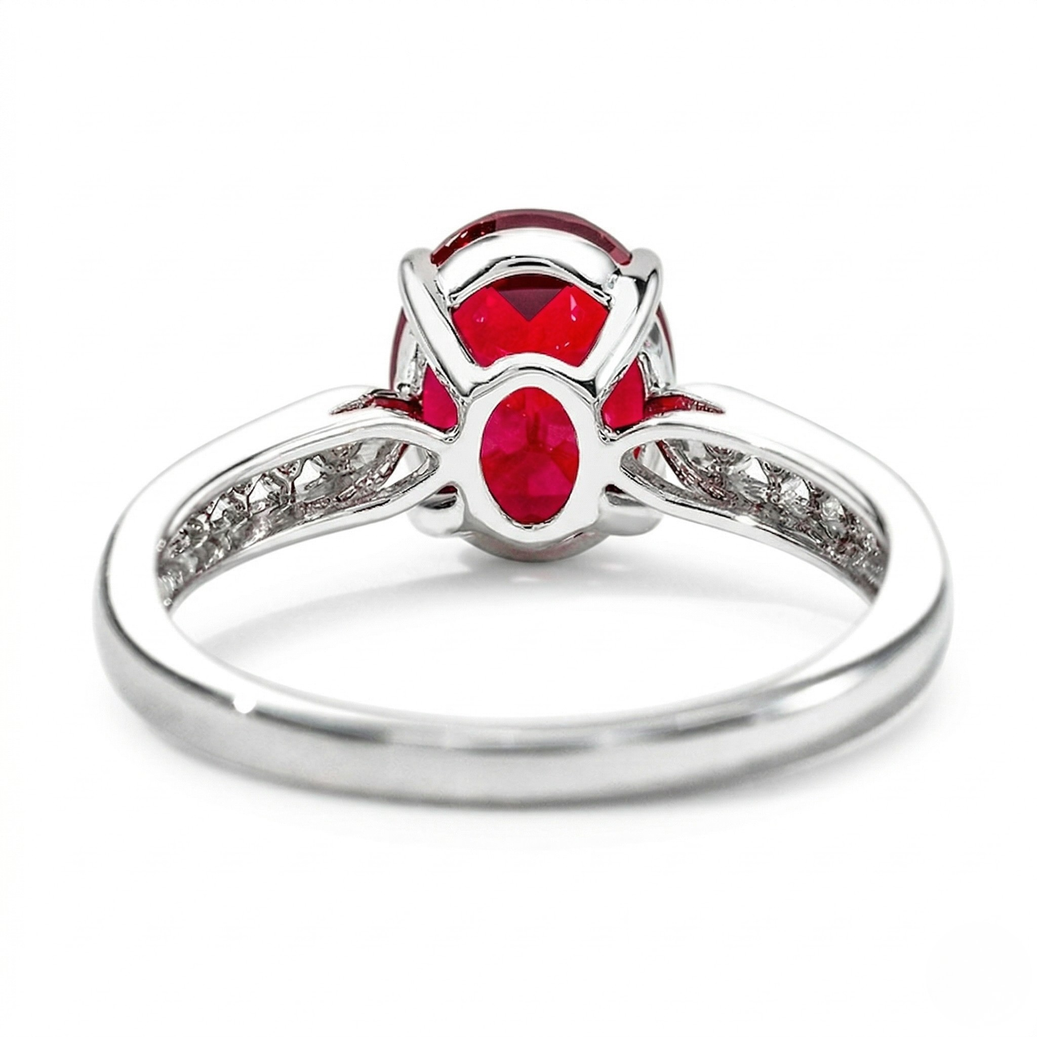 18K white gold ring with lab-created ruby centerpiece and intricate side detailing