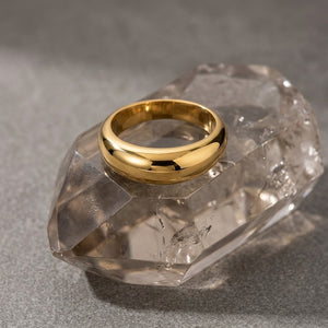 Gold Prime Vault Ring on clear crystal background, classic and polished style
