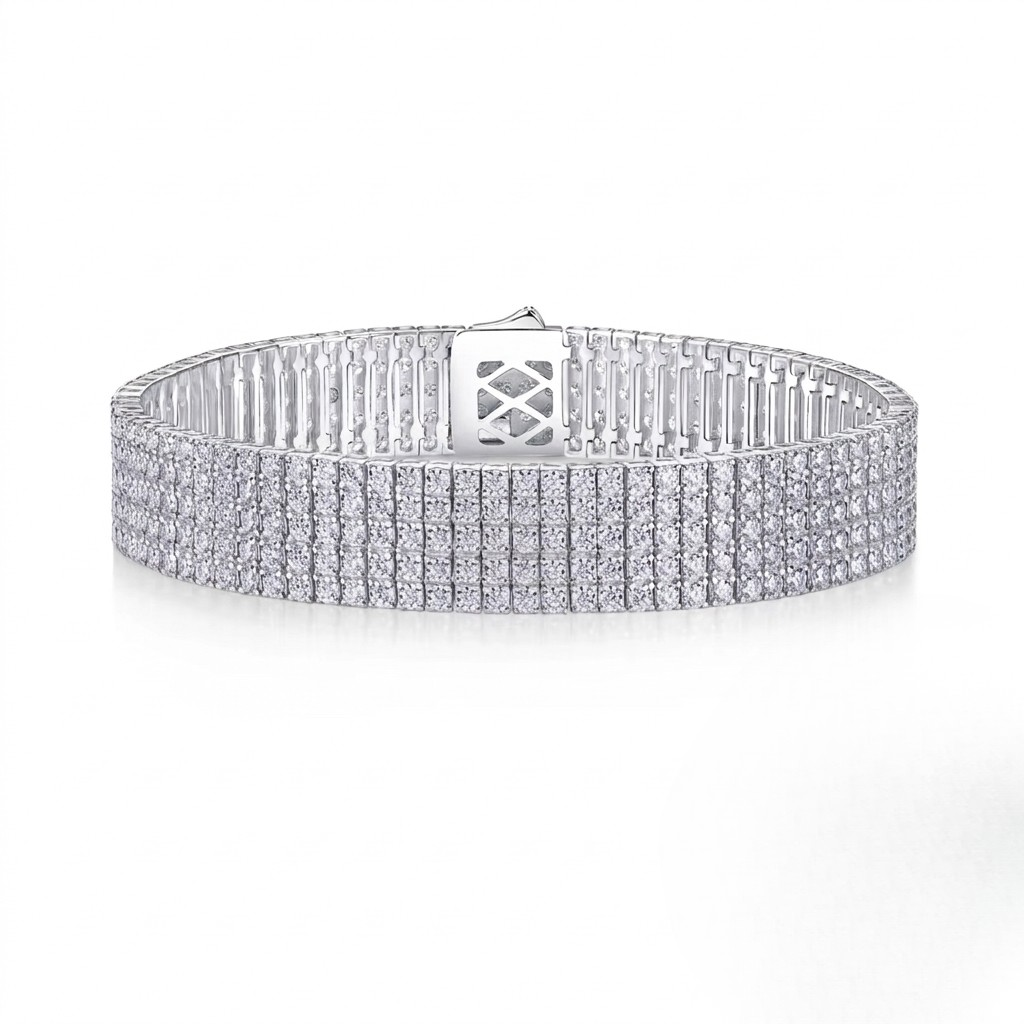Wide multi-row sterling silver tennis bracelet fully set with round cubic Moissanite crystals featuring a secure box clasp shown on a plain white background by J.Collins
