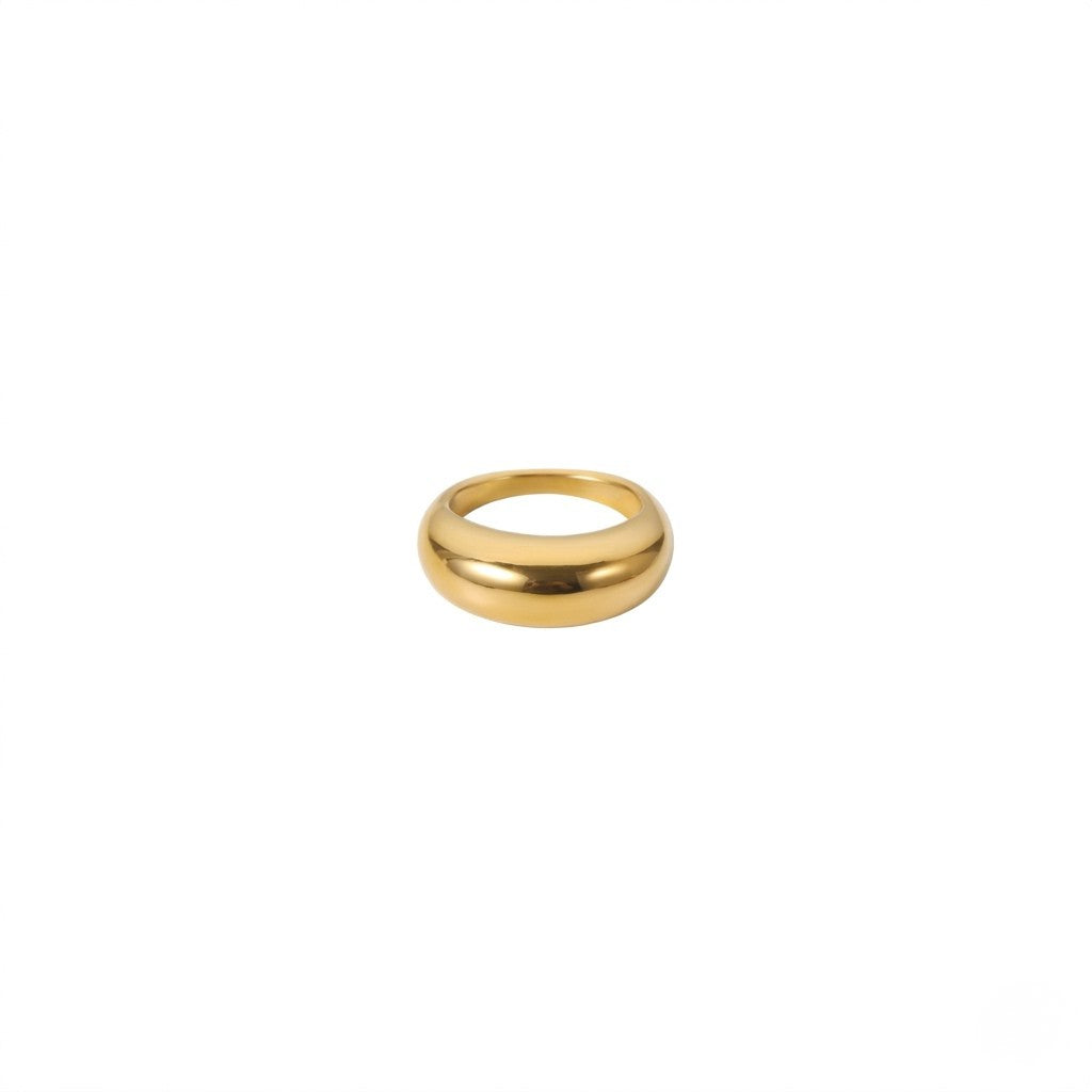 Gold dome band ring with a smooth, polished finish on a white background