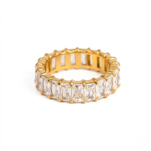 Gold band with rectangular-cut gemstones in an eternity style ring design