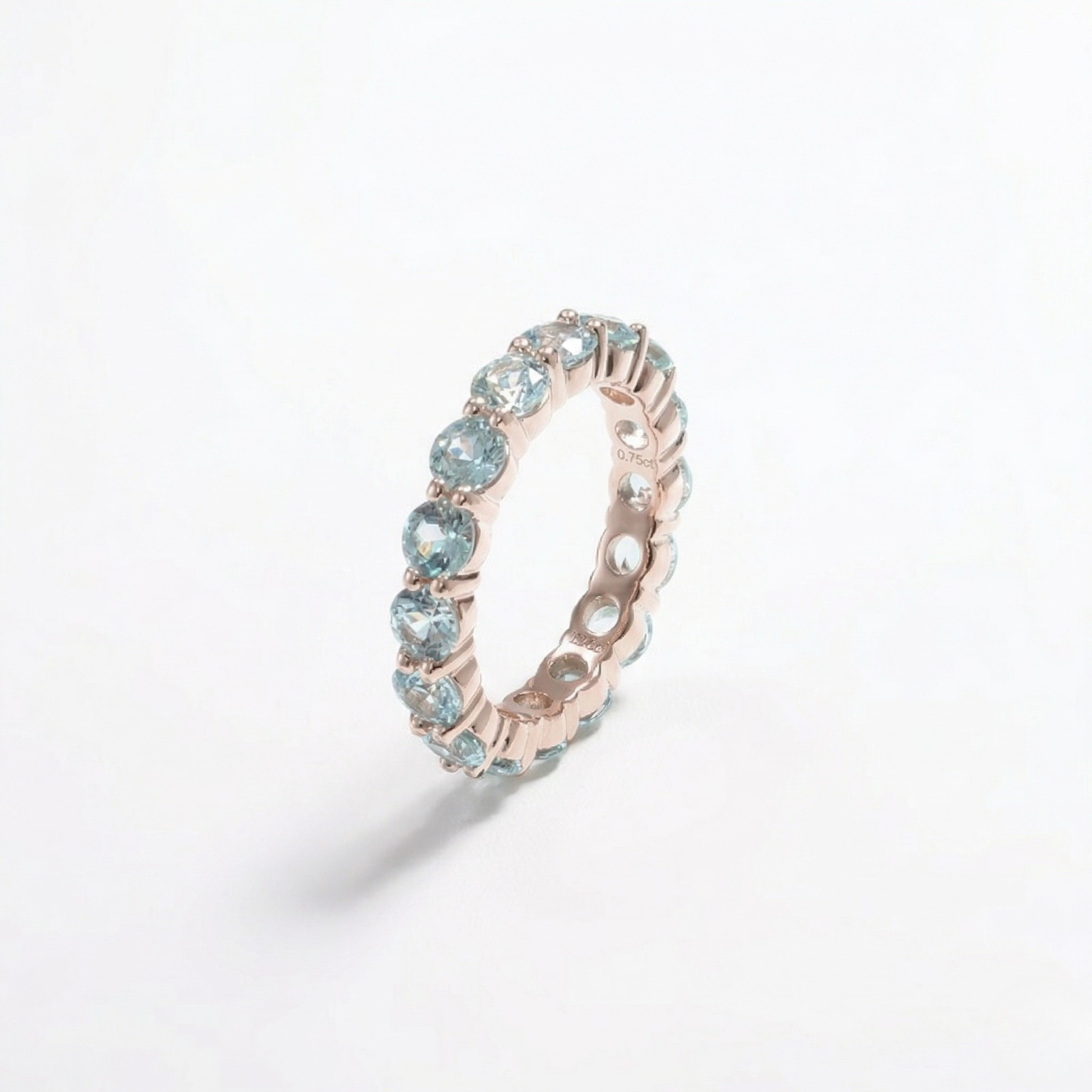 14K rose gold ring with lab color gemstones in an eternal band design, elegant and sparkling