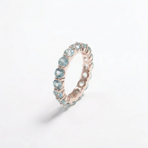 14K rose gold ring with lab color gemstones in an eternal band design, elegant and sparkling