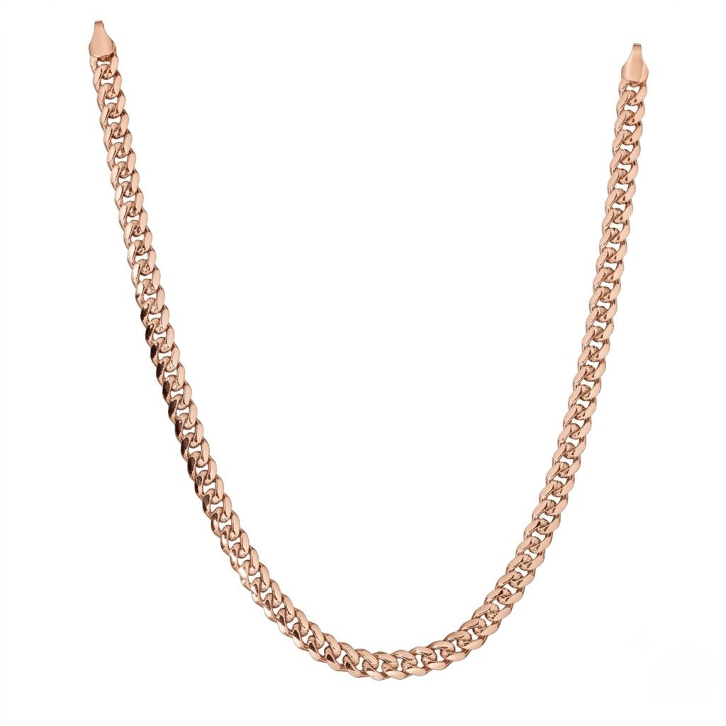 Polished rose gold cuban link chain necklace isolated on a clean white background | J.Collins Jewelry