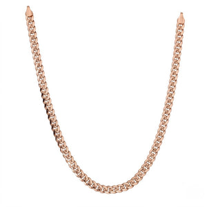 Polished rose gold cuban link chain necklace isolated on a clean white background | J.Collins Jewelry