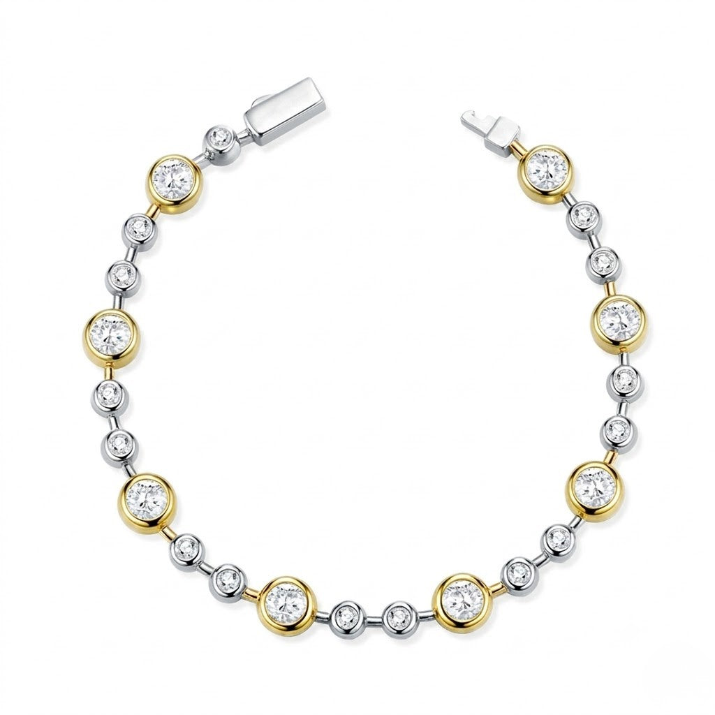 Two-tone gold and sterling silver station bracelet set with bezel-set round cubic Moissanite crystals unclasped in a circular layout on a plain white background by J.Collins
