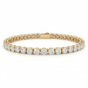 Gold tennis bracelet with 5mm clear stones and secure clasp, elegant and classic style.